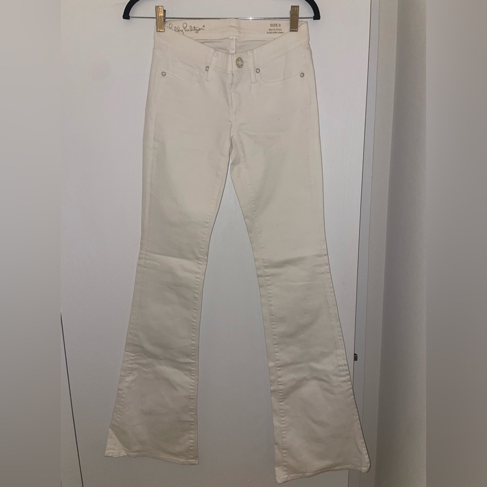 White flare bottom low to mid rise white jeans